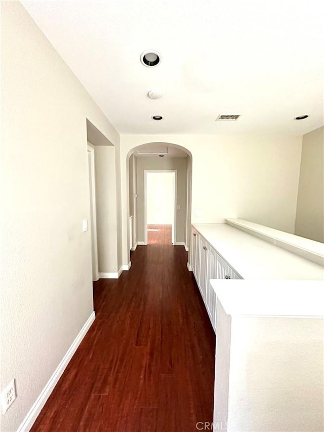 corridor featuring dark hardwood / wood-style flooring