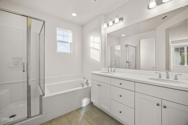 bathroom featuring tile patterned floors, vanity, and plus walk in shower