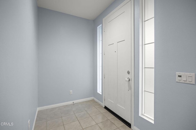 foyer with light tile patterned floors