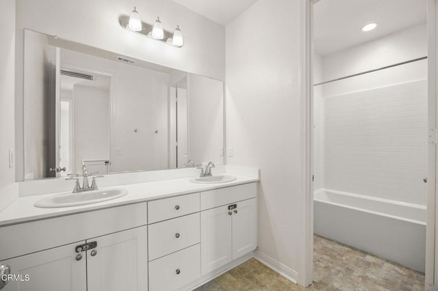 bathroom with vanity and shower / bathtub combination