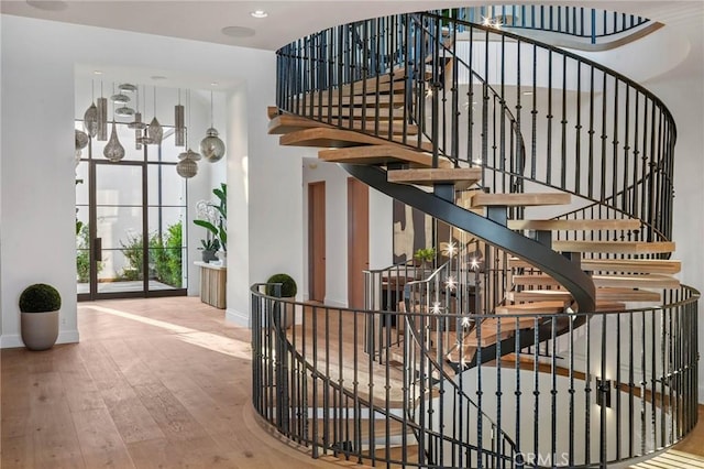 staircase with wood-type flooring