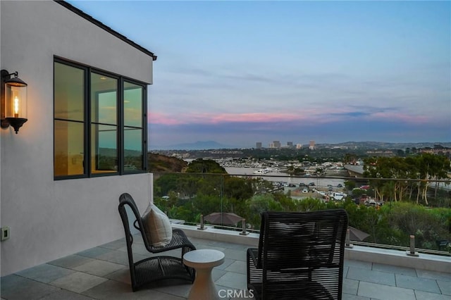 view of balcony at dusk