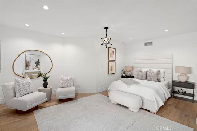 bedroom with hardwood / wood-style flooring