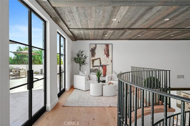 interior space with french doors and light wood-type flooring