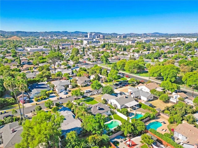 birds eye view of property with a mountain view