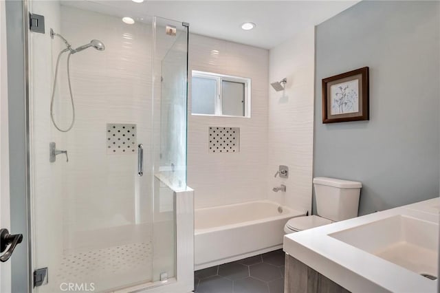 full bathroom with tile patterned flooring, shower with separate bathtub, and toilet