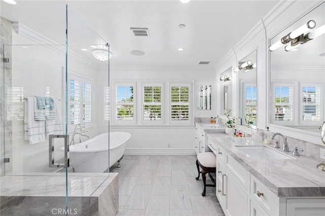 bathroom featuring separate shower and tub, vanity, and ornamental molding