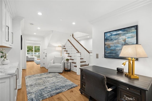 office area featuring light hardwood / wood-style flooring and ornamental molding