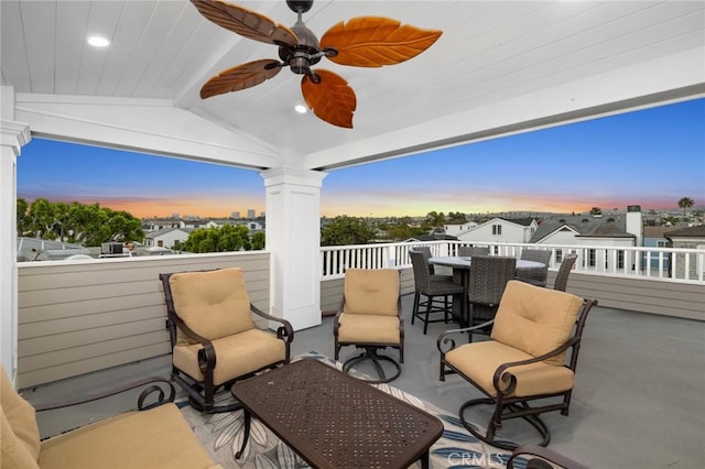 patio terrace at dusk featuring ceiling fan