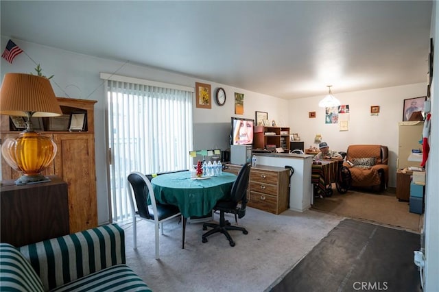 view of carpeted dining space