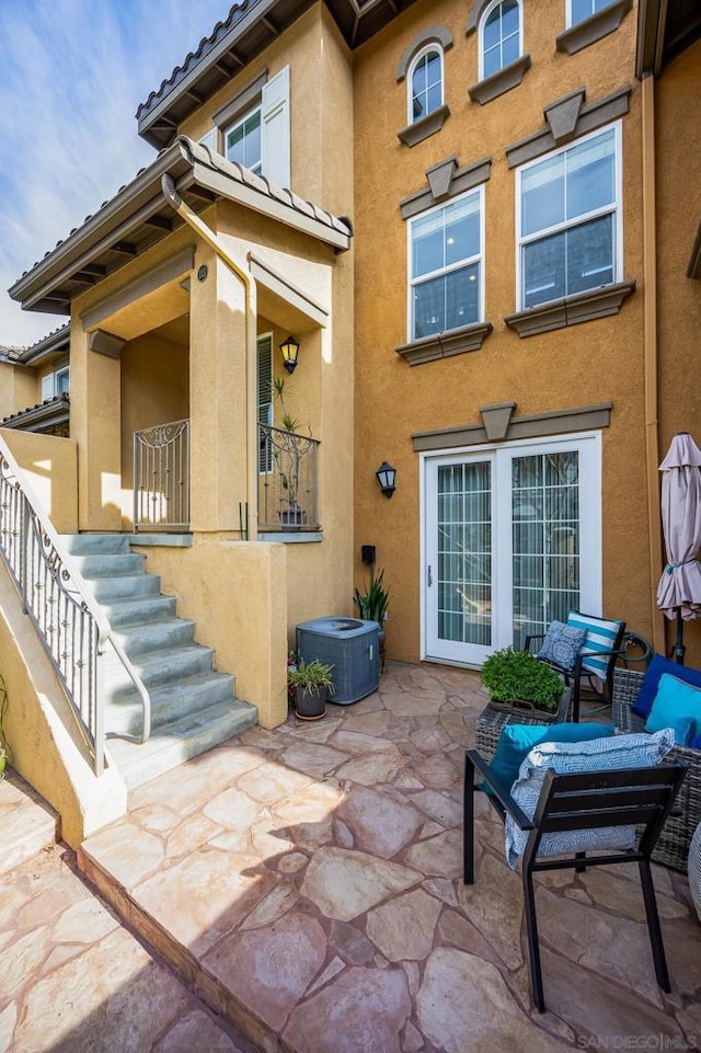 exterior space featuring a patio area and central air condition unit