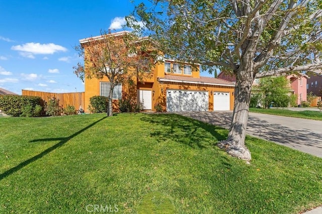 front of property with a garage and a front lawn