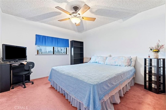 bedroom with carpet flooring, ceiling fan, and a textured ceiling