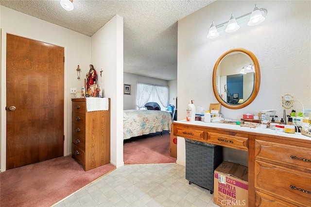 bathroom with vanity and a textured ceiling