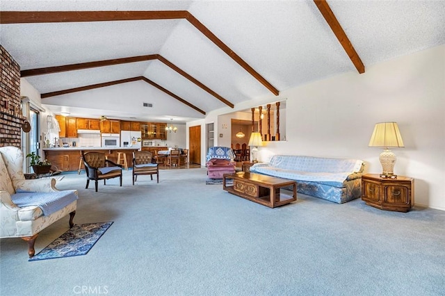 carpeted living room with a chandelier, a textured ceiling, and lofted ceiling with beams