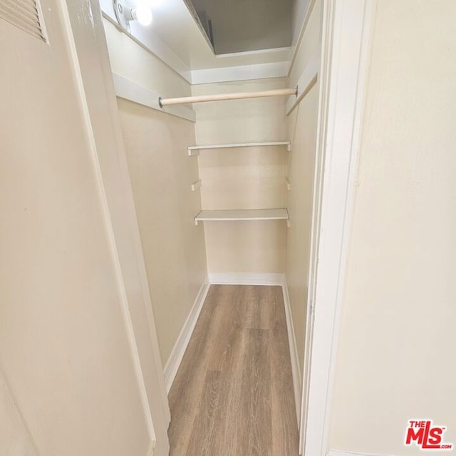 spacious closet featuring light wood-type flooring