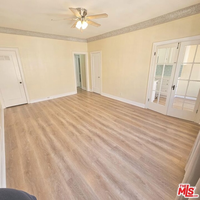 empty room featuring ceiling fan and light hardwood / wood-style floors