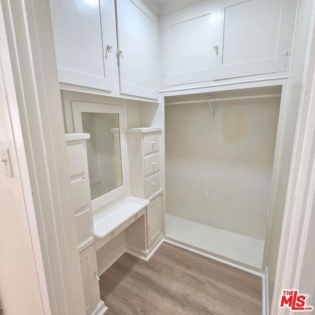 mudroom with light hardwood / wood-style floors