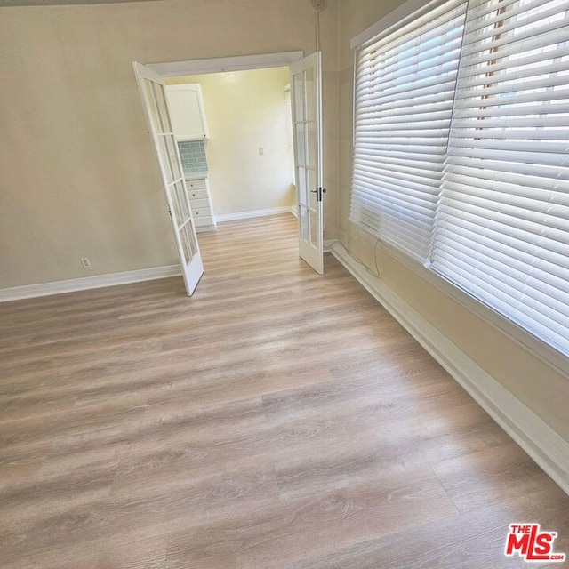 unfurnished room featuring light hardwood / wood-style floors