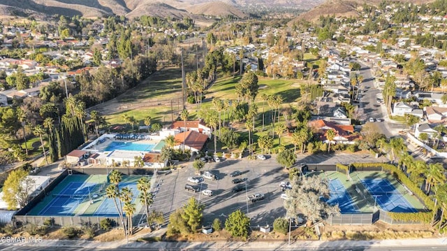 birds eye view of property featuring a mountain view