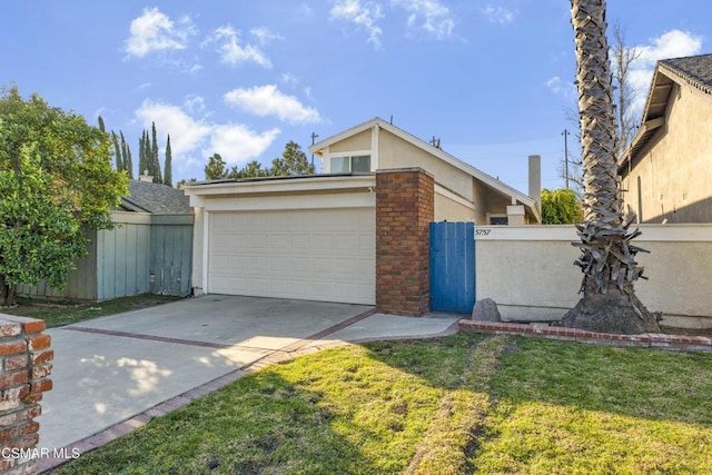 exterior space with a garage and a lawn