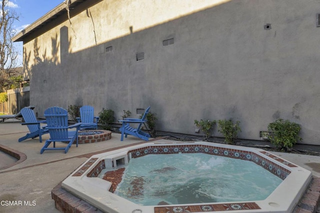 view of swimming pool with an in ground hot tub and a patio area