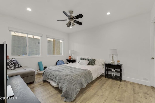 bedroom with light hardwood / wood-style floors and ceiling fan