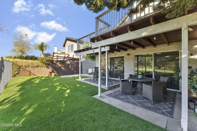 view of yard with a balcony and a patio area