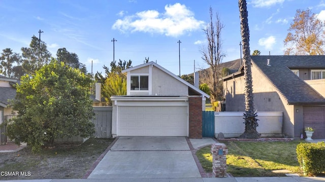 view of front facade featuring a garage and a front lawn