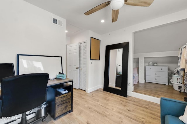 office space featuring light hardwood / wood-style flooring and ceiling fan