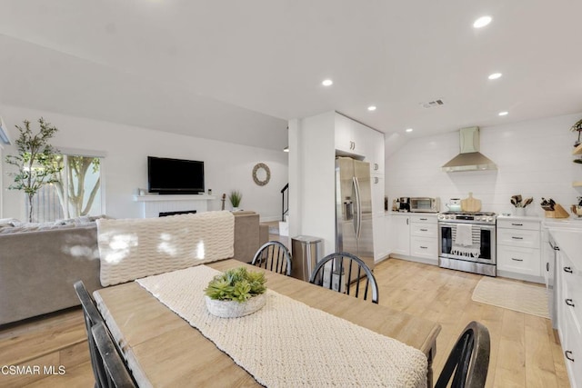 dining space with light wood-type flooring