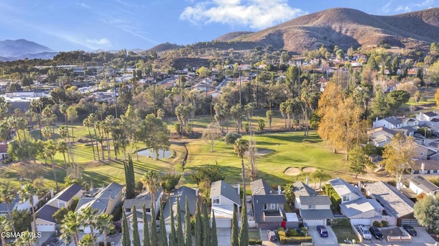 birds eye view of property featuring a mountain view