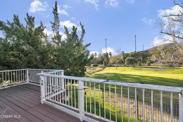 wooden terrace with a yard