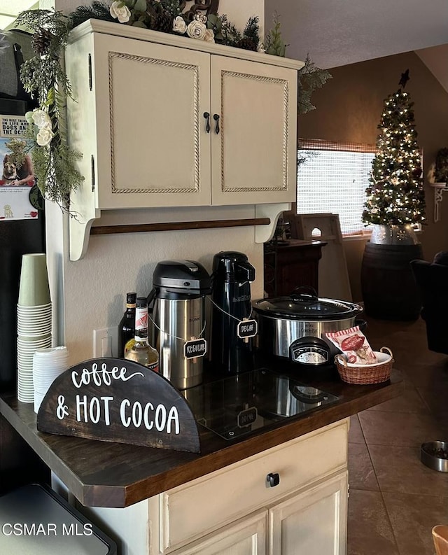 kitchen featuring dark tile patterned flooring