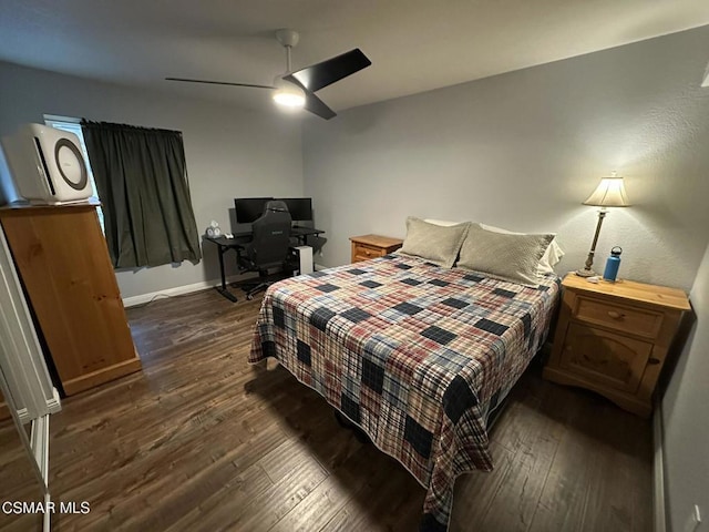 bedroom featuring ceiling fan and dark hardwood / wood-style flooring