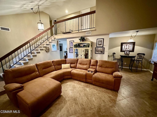 living room featuring high vaulted ceiling