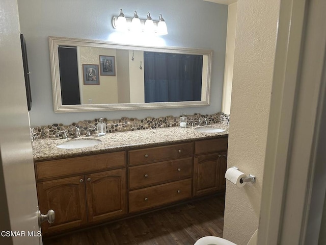 bathroom featuring hardwood / wood-style floors and vanity