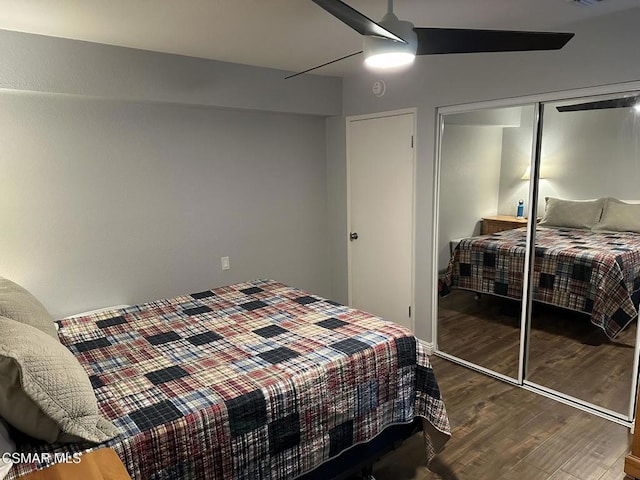 bedroom with ceiling fan, a closet, and wood-type flooring