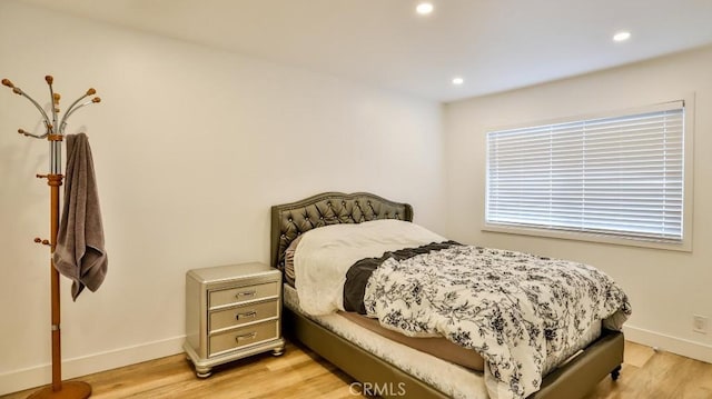 bedroom featuring light hardwood / wood-style flooring