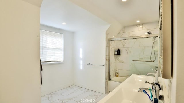 bathroom featuring bath / shower combo with glass door