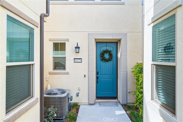 property entrance featuring central AC unit