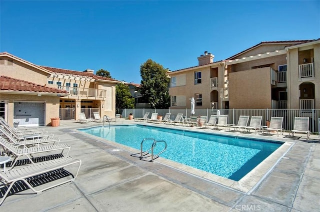 view of swimming pool with a patio area