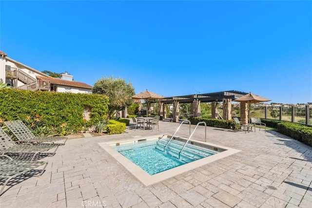 view of pool featuring a community hot tub and a pergola