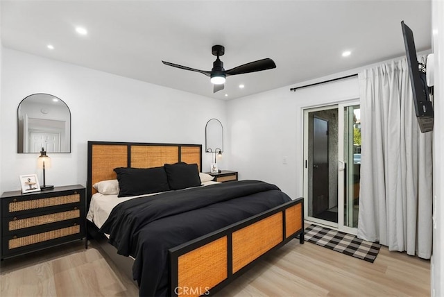 bedroom featuring access to exterior, light hardwood / wood-style floors, and ceiling fan