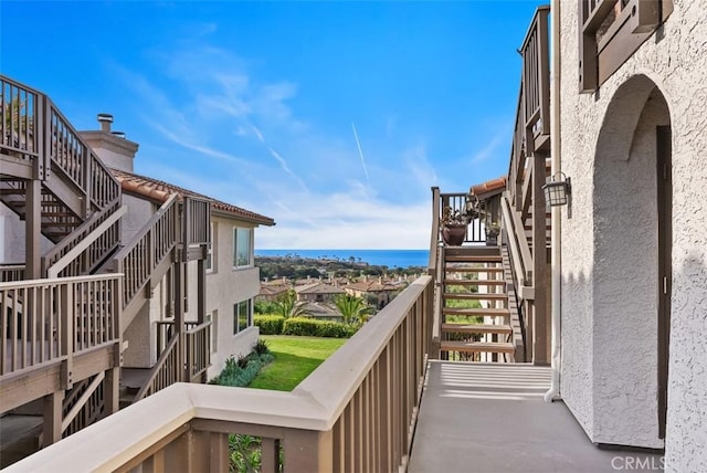 balcony featuring a water view