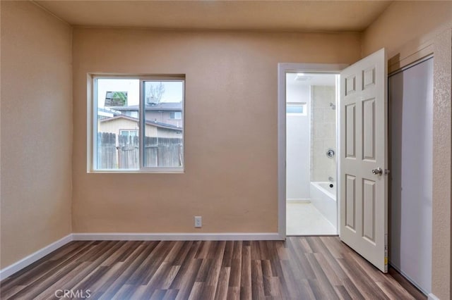 unfurnished bedroom with hardwood / wood-style flooring