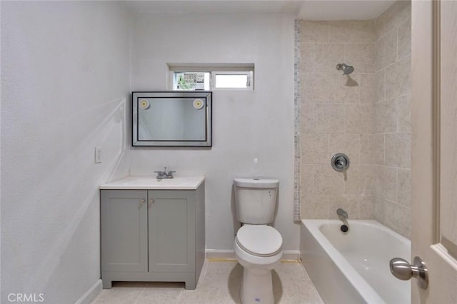 full bathroom featuring tile patterned flooring, vanity, toilet, and tiled shower / bath