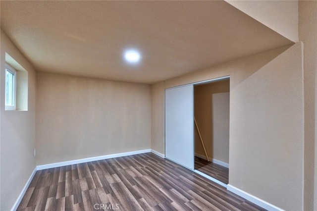 empty room featuring dark wood-type flooring