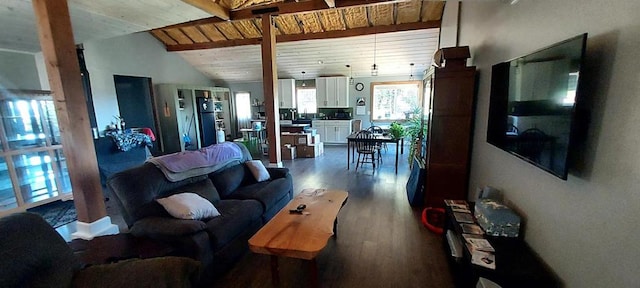 living room featuring vaulted ceiling with beams, hardwood / wood-style flooring, and wooden ceiling