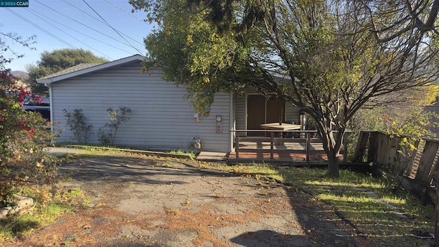 view of side of property featuring a deck